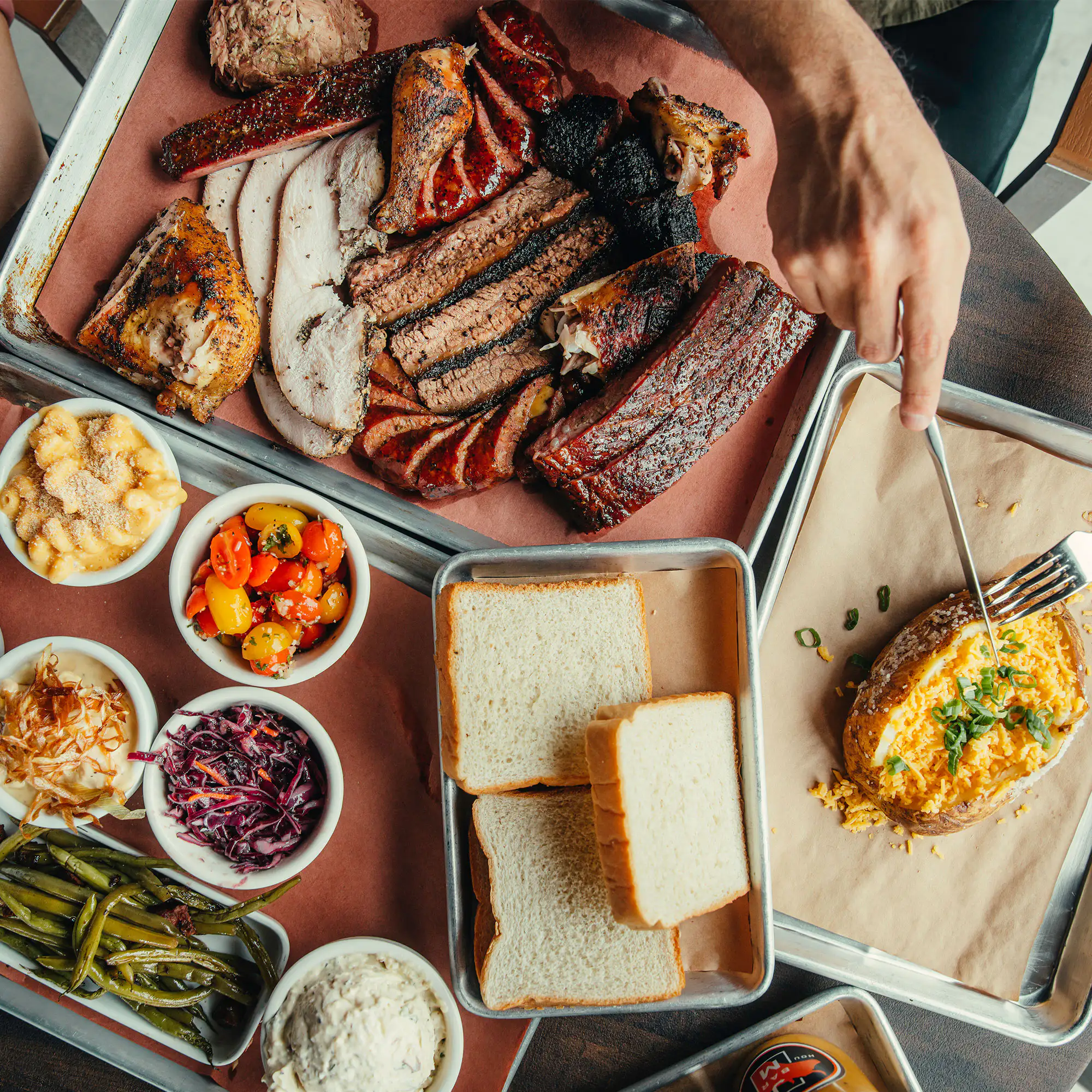 A wide spread of bbq and side dishes